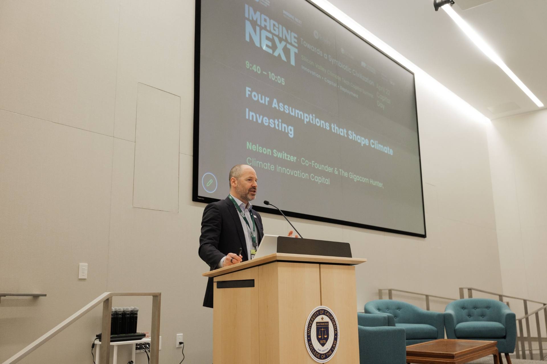 Nelson Switzer presenting 'Four Assumptions that Shape Climate Investing' keynote at UC Law