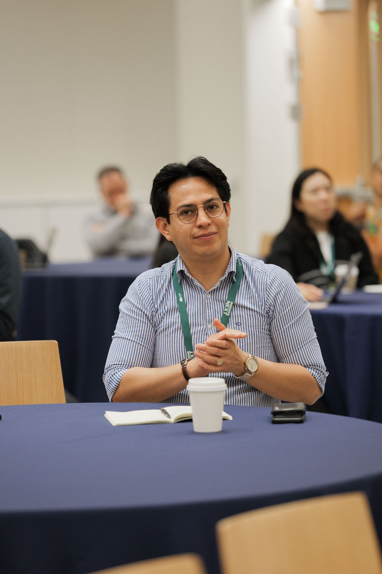 Attendee listening attentively at a Capital Day round table