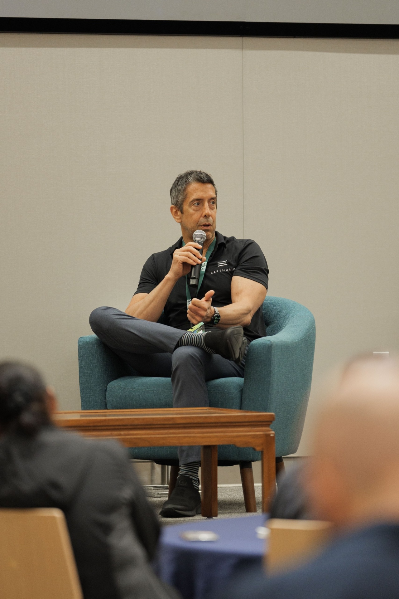 Troy Helming, Founder & CEO of Earthgrid, holding the mic during the Capital Day fireside on climate tech deployment