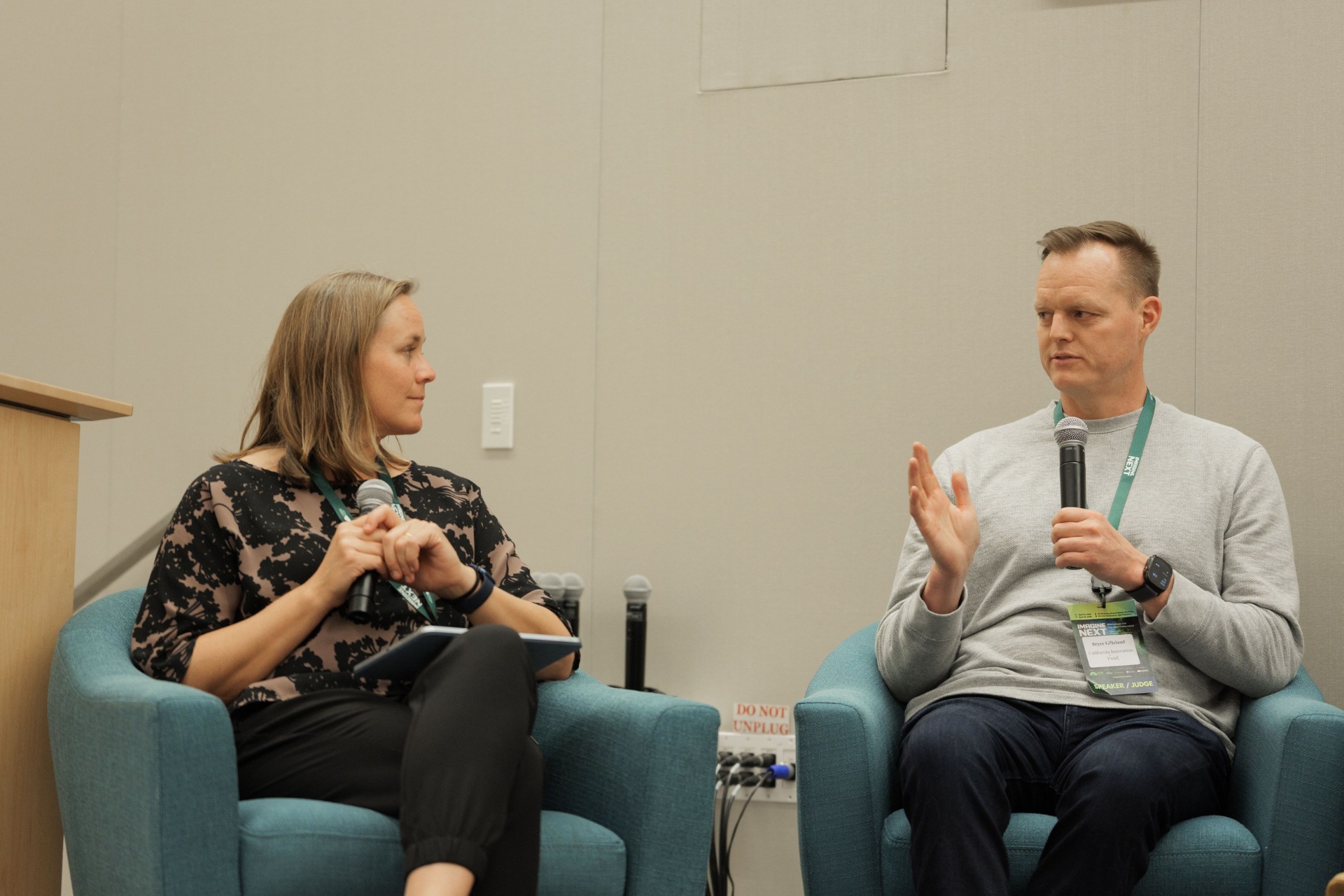 Bryce Gilleland, General Partner at California Innovation Fund, gesturing while speaking with moderator Christina Cairns on Capital Day Panel 5 'From Growth to Bankability'