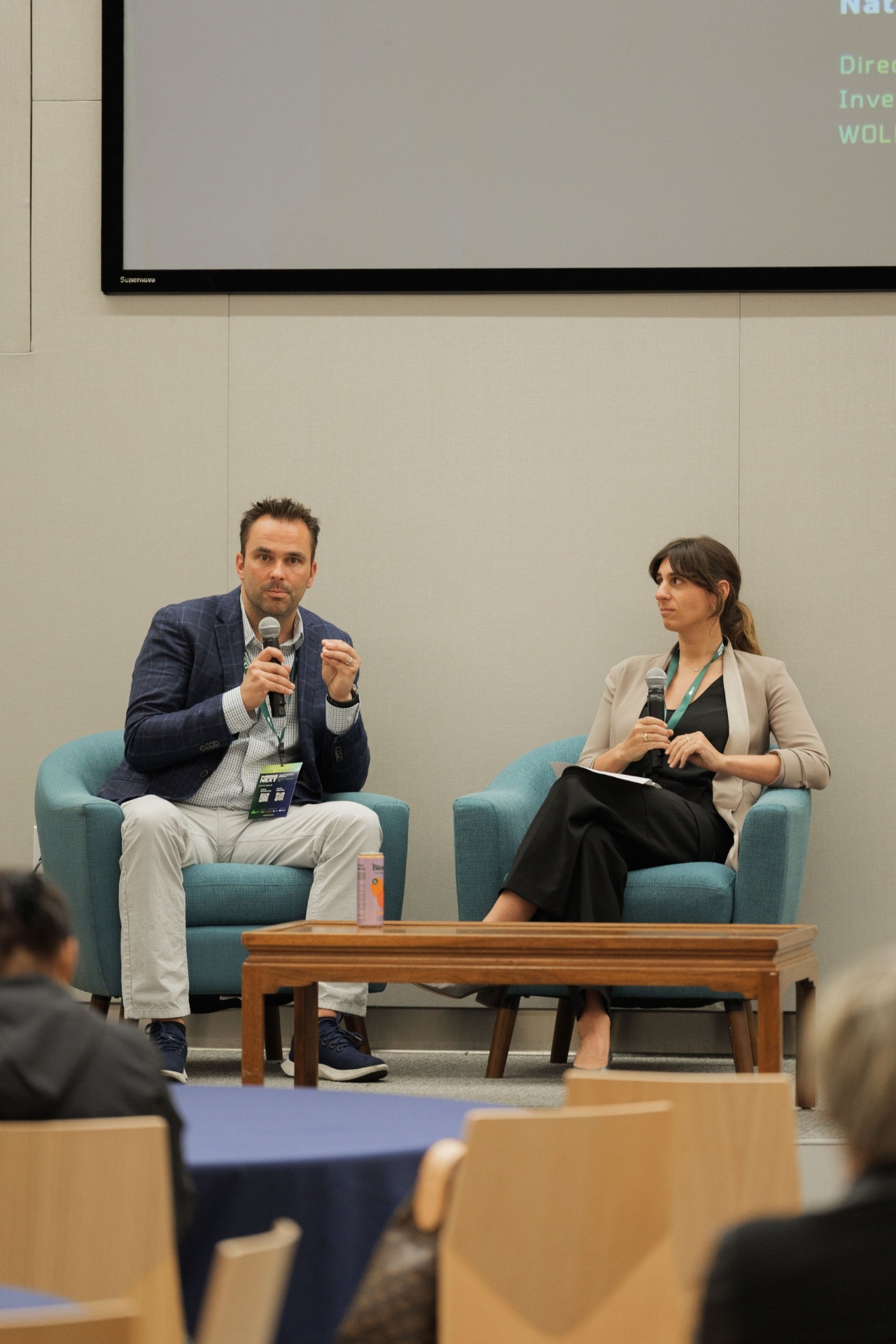 Dr. Ryan Gilliam, CEO of Fortera, gesturing while speaking with Natalie Volpe of WOLLEMI on the Capital Day fireside chat at UC Law SF