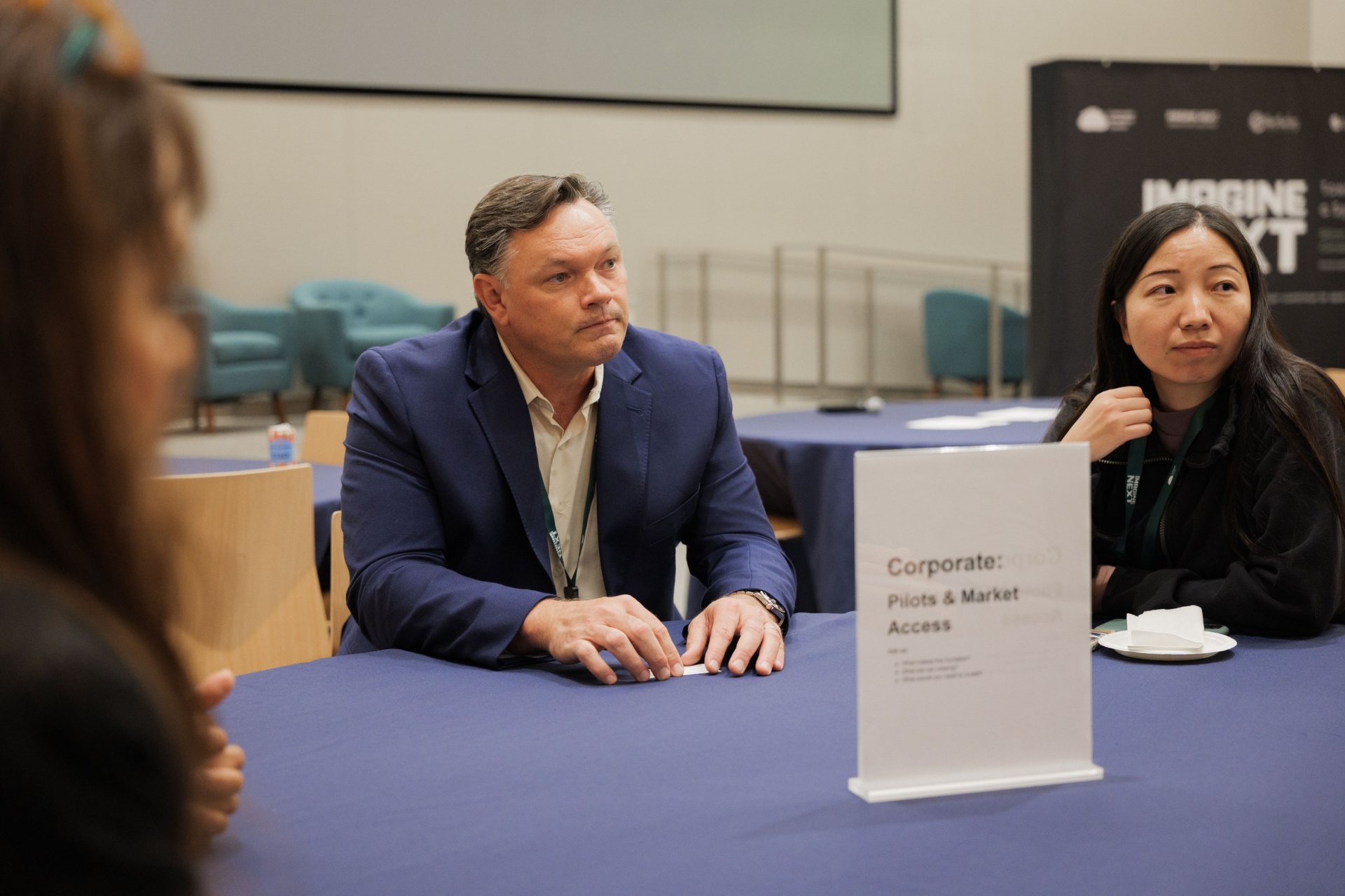 Capital Day Curated Capital Matchmaking Session — 'Corporate: Pilots & Market Access' table with founder and corporate delegate in conversation at UC Law SF
