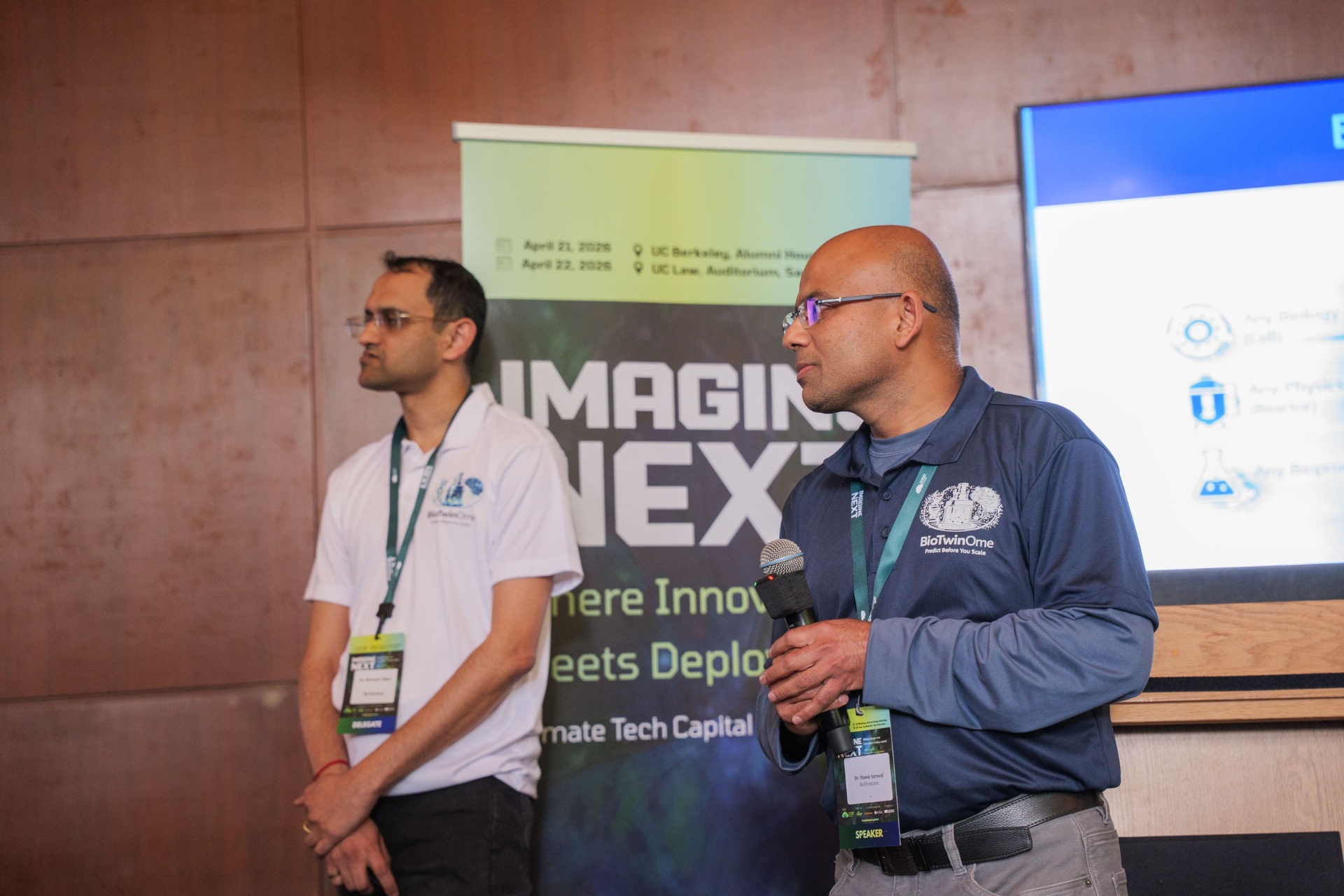 BioTwinOme co-founders pitching beside the Imagine Next banner