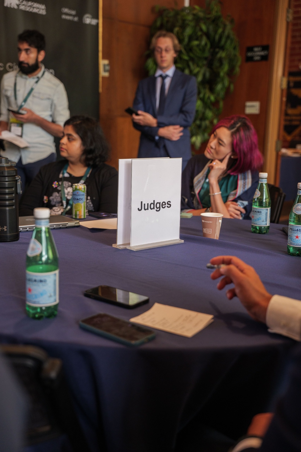 Judges table marker with jury members in the background