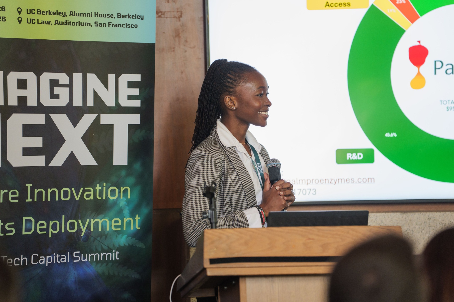 Hawi Odhiambo of PalmPro Enzymes pitching at the podium